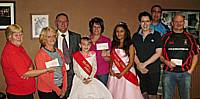 Milnrow Carnival Committee Chairman Paul Kettle and the Carnival Queens with 3 successful Charities who each received £500 from the proceeds of Milnrow Carnival 2009